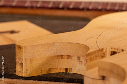 body and neck of a guitar in production
