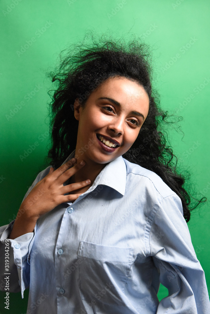 Overjoyed girl , Photo of african girl wears blue shirt , Emotions and pleasant feelings concept. Overjoyed girl , Photo of african girl wears blue shirt , Emotions and pleasant feelings concept.