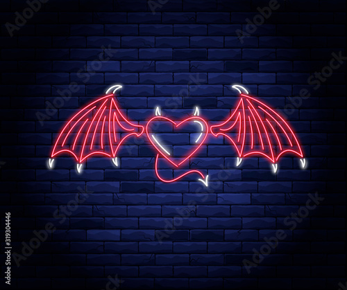 Illuminated neon heart with devil wings