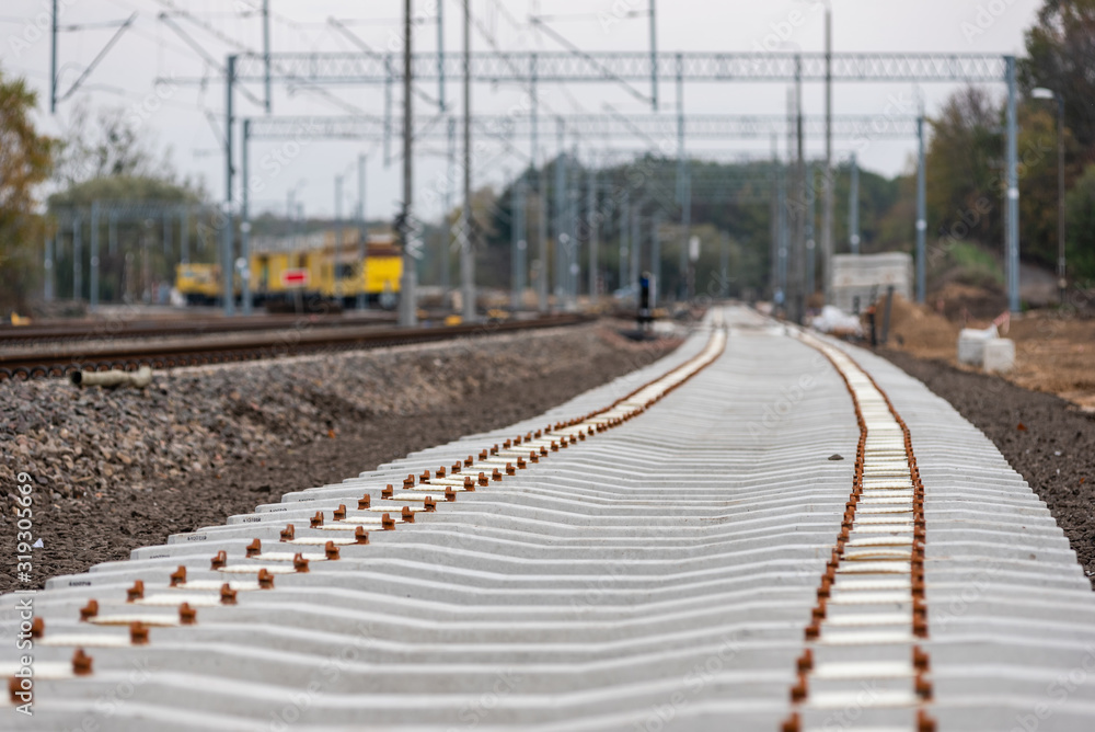 Modernization of the railway line. New track, crushed stone, railway sleepers - close-up