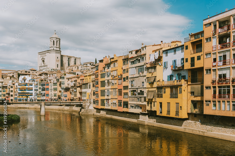 Landscape of Girona city, Catalonia, Spain. View on St. Agusti Bridge and Saint Mary Cathedral
