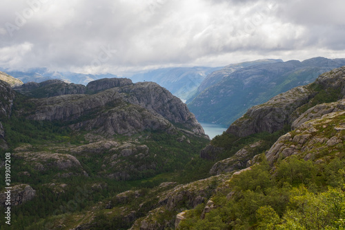 Preikestolen massive cliff Norway  Lysefjorden summer morning view . Beautiful natural vacation hiking walking travel to nature destinations concept. July 2019