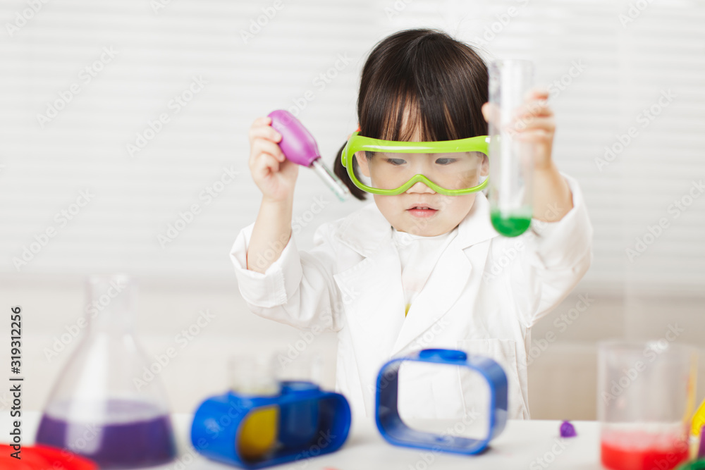 toddler girl pretend play scientist role at home against white background toddler girl pretend play scientist role at home against white background