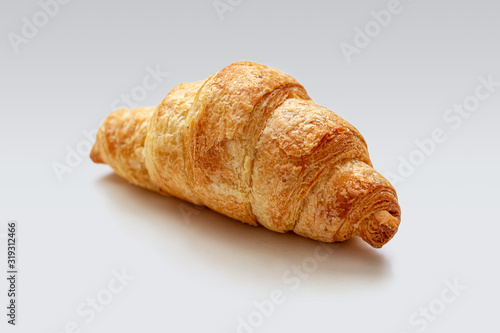 Fresh mini croissant with a Golden crust on a white background