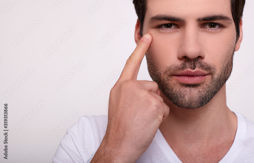 Close-up, a portrait of a young well-groomed handsome guy. Close-up, a portrait of a young well-groomed handsome guy.