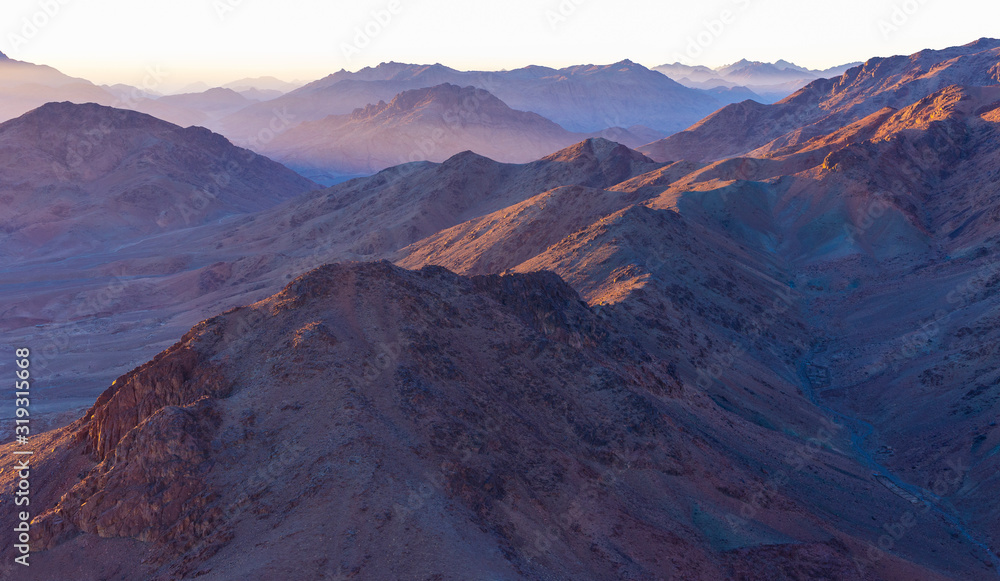 Egypt. Mount Sinai in the morning at sunrise. (Mount Horeb, Gabal Musa, Moses Mount). Pilgrimage place and famous touristic destination. Egypt. Mount Sinai in the morning at sunrise. (Mount Horeb, Gabal Musa, Moses Mount). Pilgrimage place and famous touristic destination.