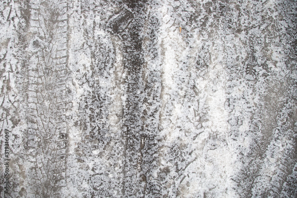Ice with tire and shoe tread marks Ice with tire and shoe tread marks
