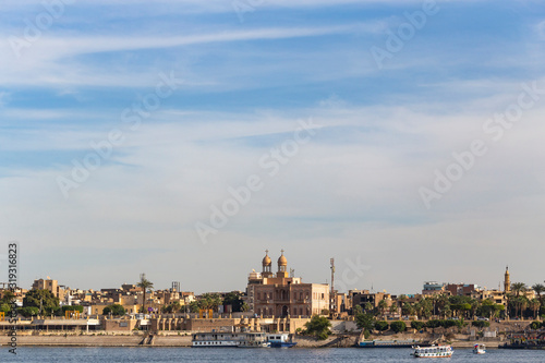 Luxor, Egypt, Karnak Temple, complex of Amun-Re. View of the ancient city of Thebes from the Nile. Panoramic city, view from the river.