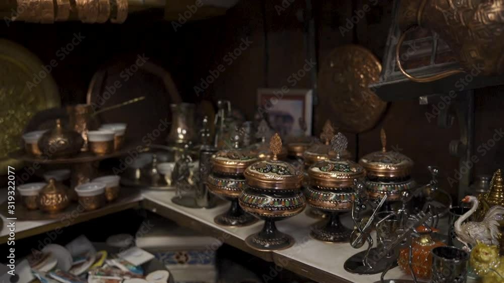 Sarajevo street bazaars with delight cups, pots, tea kettles and souvenirs made of copper. Traditional Sarajevo antique shop made by Coppersmith. Bascarsija is most popular traveling destination Sarajevo street bazaars with delight cups, pots, tea kettles and souvenirs made of copper. Traditional Sarajevo antique shop made by Coppersmith. Bascarsija is most popular traveling destination