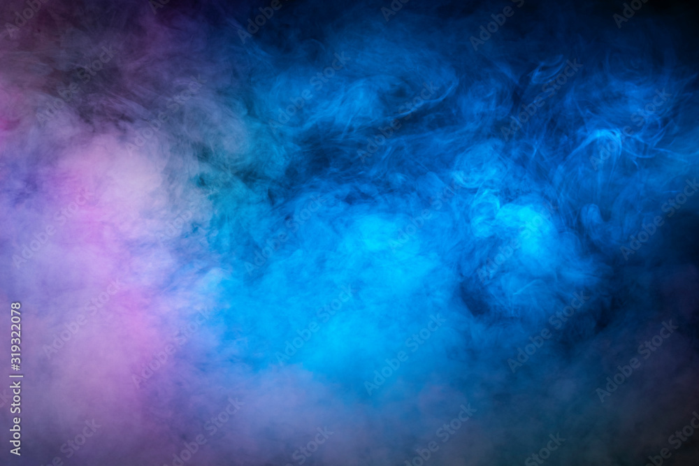 Backlit smoke abstract texture in pink blue on black background.