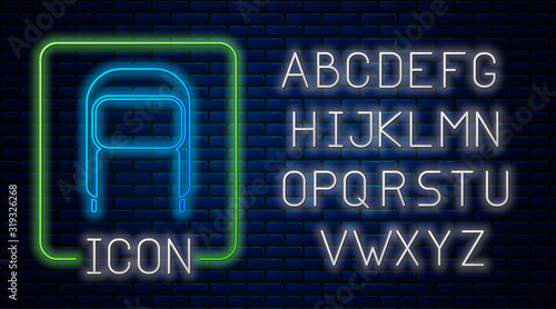 Glowing neon Winter hat with ear flaps icon isolated on brick wall background. Neon light alphabet. Vector Illustration