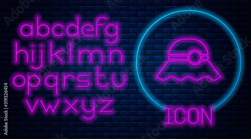 Glowing neon Elegant women hat icon isolated on brick wall background. Neon light alphabet. Vector Illustration