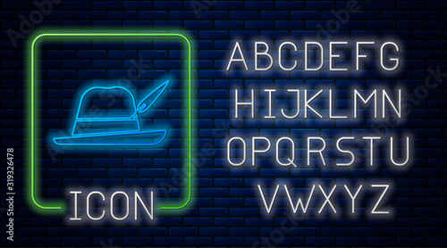 Glowing neon Oktoberfest hat icon isolated on brick wall background. Hunter hat with feather. German hat. Neon light alphabet. Vector Illustration