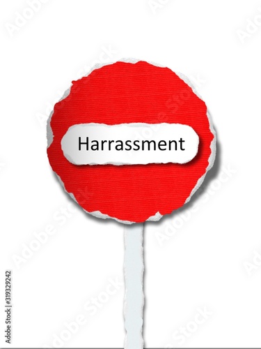 Harassment -  word in ragged paper stop sign background - bullying - concept tattered illustration photo