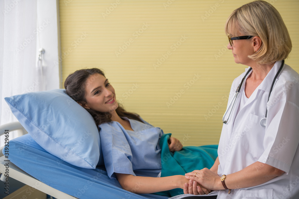 Fototapeta premium The doctor and the patient are in bed.