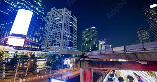 4K timelapes night of bangkok, at skytrain station Chong Nonsi skywalk (BTS) on the Silom Line, Concept of business city.