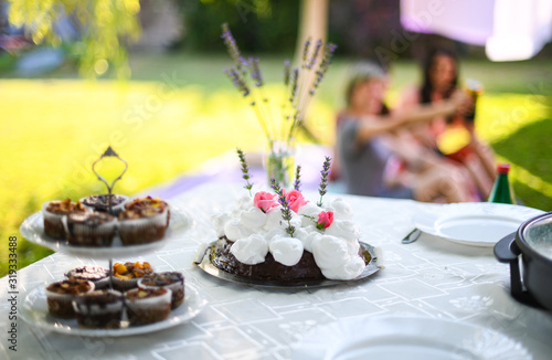 Desserts on table in yard in sunny day 