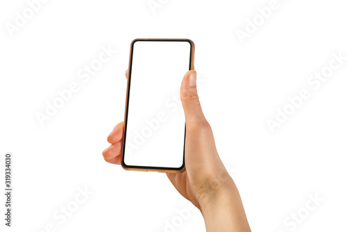 Woman hand holding the black smartphone with blank screen and modern frameless design positions angled and vertical - isolated on white background