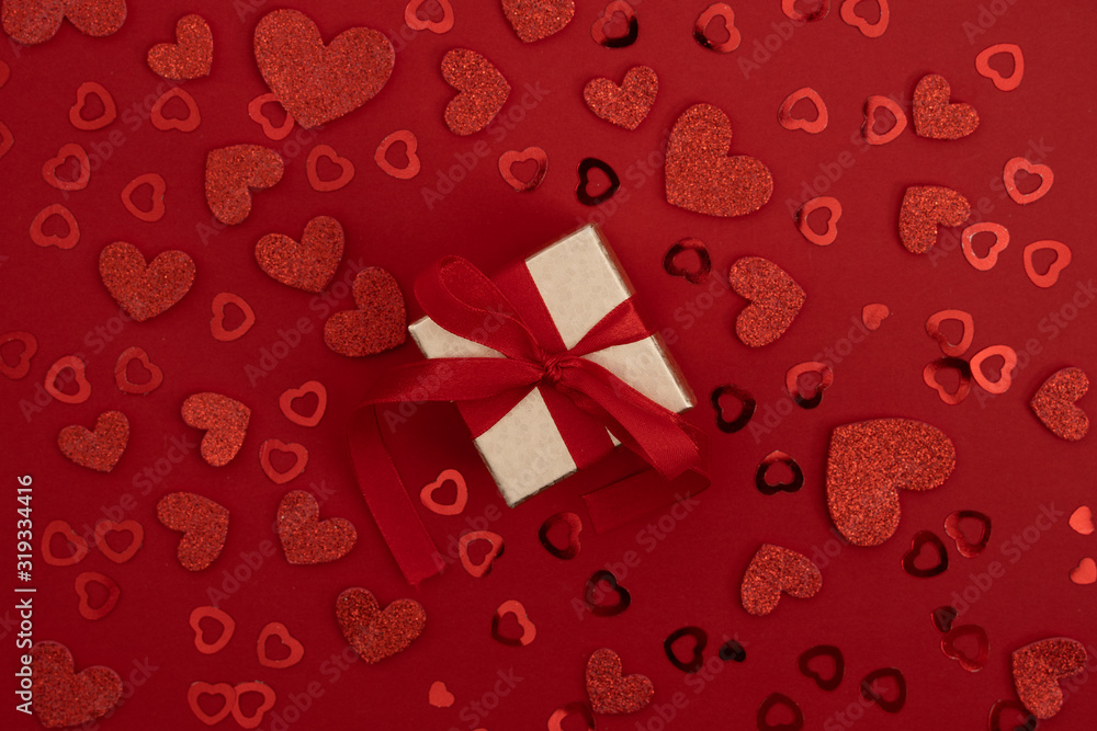 Present for Valentines day over red background Present for Valentines day over red background