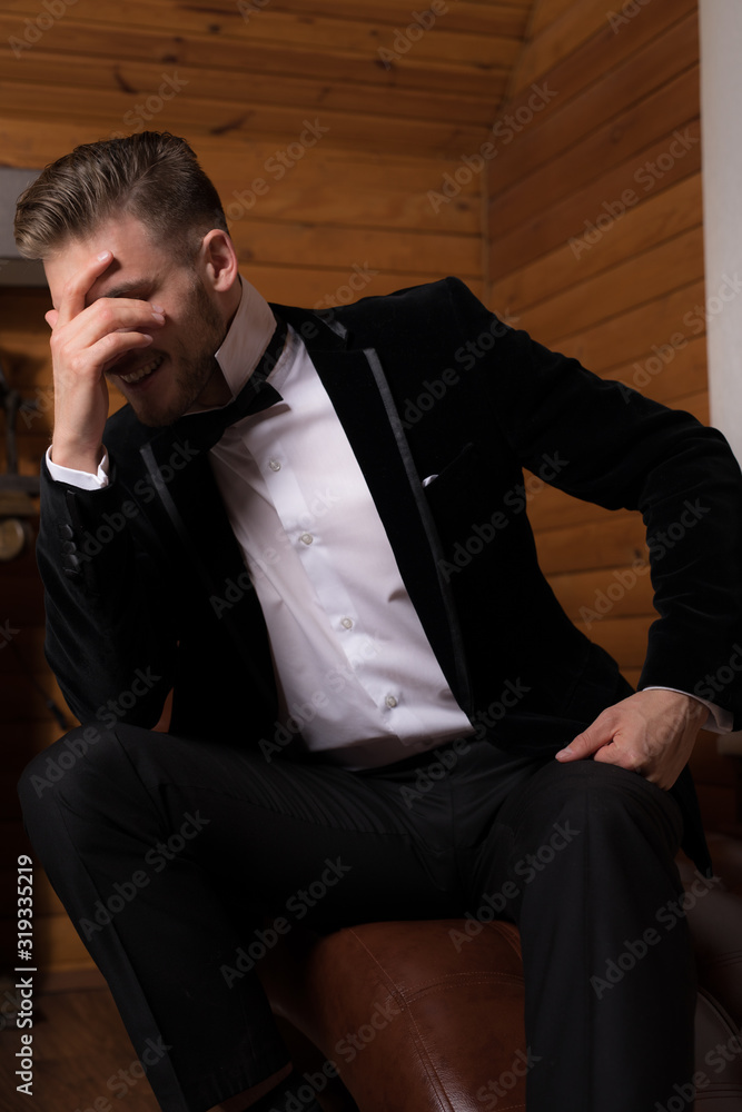 Handsome young elegant man in house interior. Handsome young elegant man in house interior.