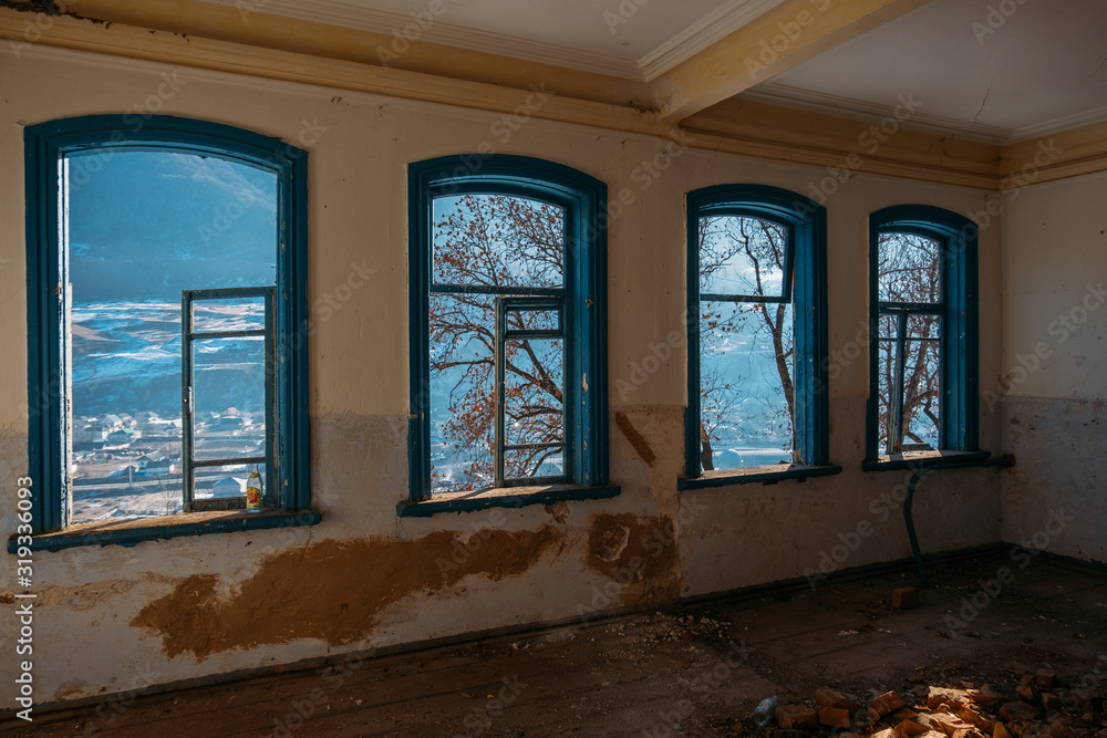 Fototapeta premium Interior of messy dirty room at old abandoned building
