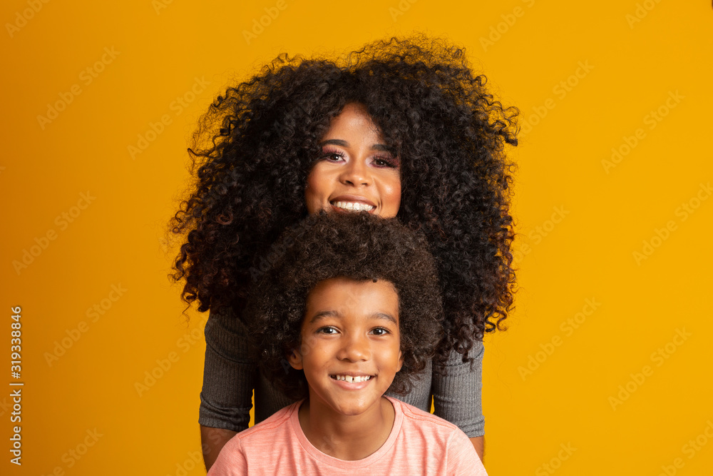 Mother and son with black power style hair. Mother and son with black power style hair.