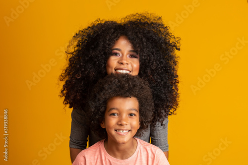 Mother and son with black power style hair.