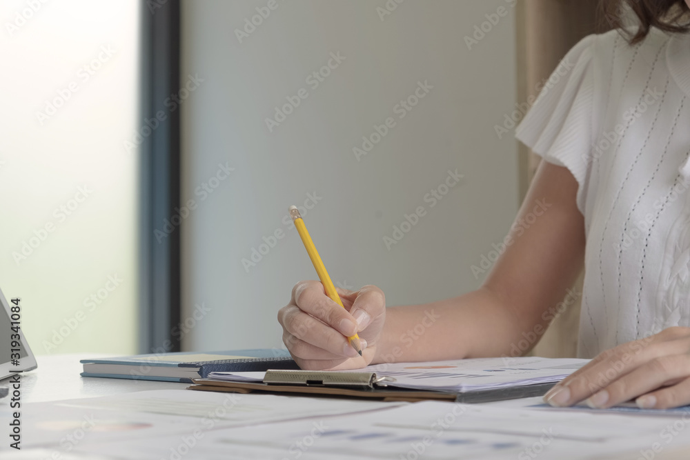 businesswoman working with business document and laptop computer for use as office workplace concept businesswoman working with business document and laptop computer for use as office workplace concept