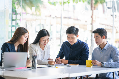 Wallpaper Mural Business team discussing together in conference room during meeting at office. Teamwork, brainstorm and ideas concept. saleperson using tablet and presentation somthing to client. Torontodigital.ca