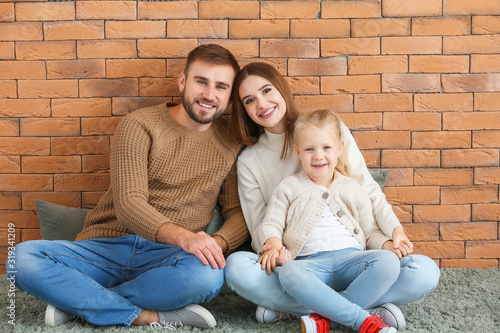 Happy young family with lit...
