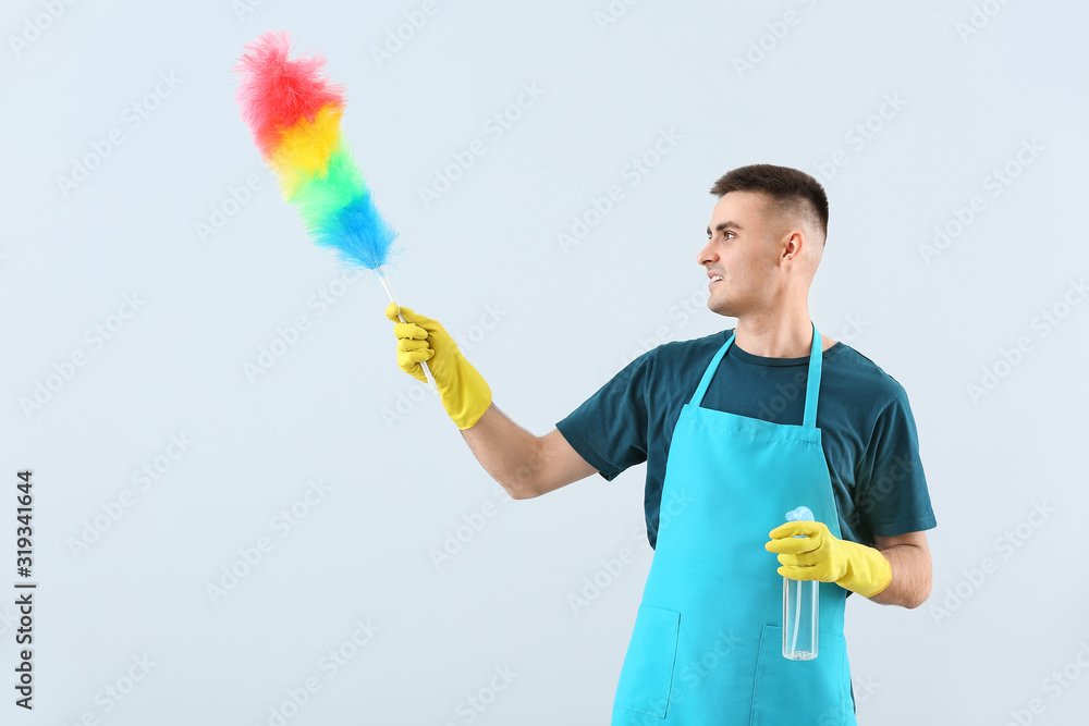 Portrait of janitor on light background Portrait of janitor on light background