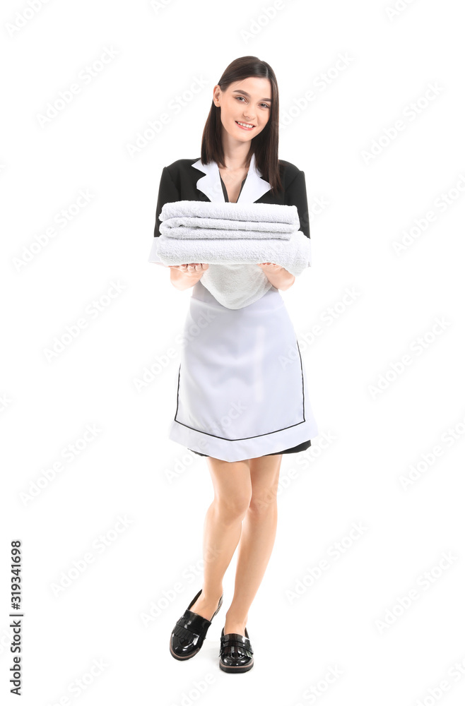 Portrait of beautiful chambermaid with clean towels on white background Portrait of beautiful chambermaid with clean towels on white background