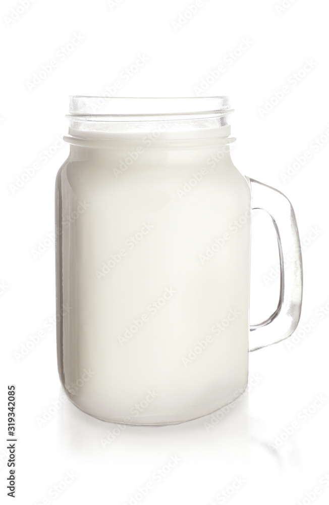 Mason jar of tasty milk on white background Mason jar of tasty milk on white background