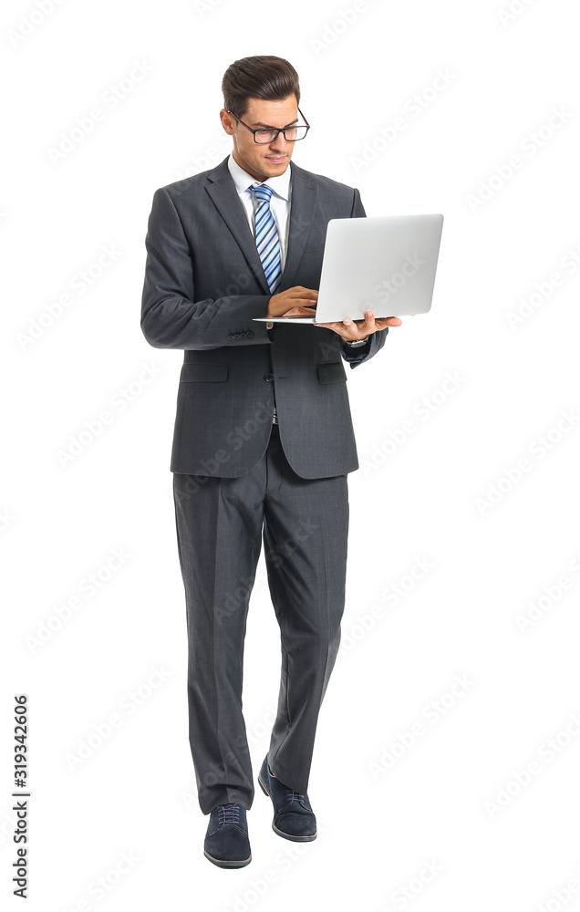 Handsome businessman with laptop on white background