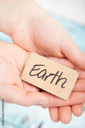 Mother earth and mother nature concept in human hands