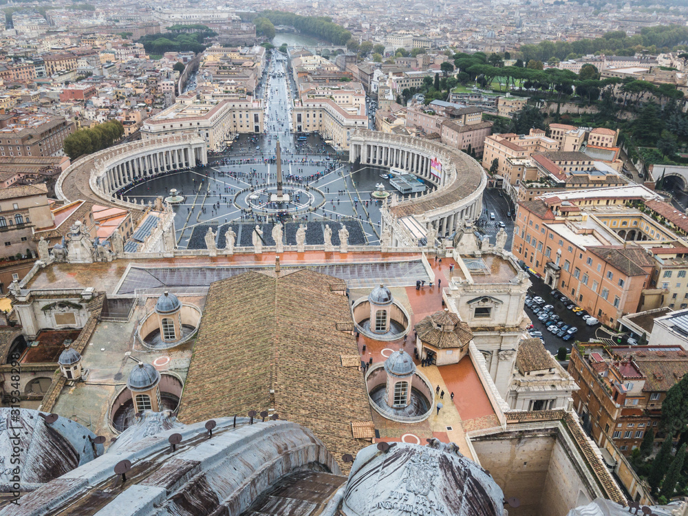 View from the top of The Papal Basilica of St. Peter in the Vatican (Italian: Basilica Papale di San Pietro), a church in the Renaissance style in Vatican City,  St. Peter's Square