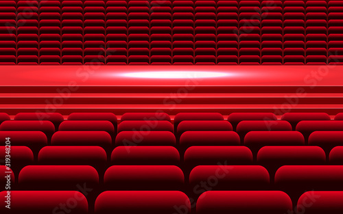 Red chairs and stage in the theater	
