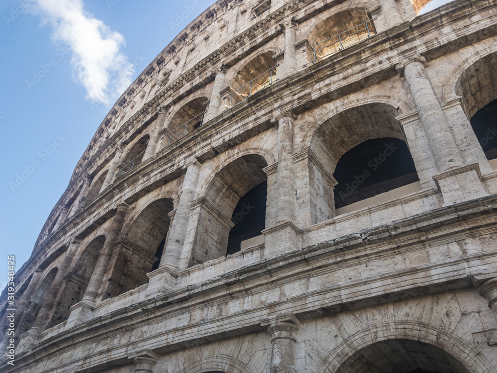 Obraz premium The Colosseum or Coliseum or the Flavian Amphitheatre, an oval amphitheatre in the centre of the city of Rome, Italy