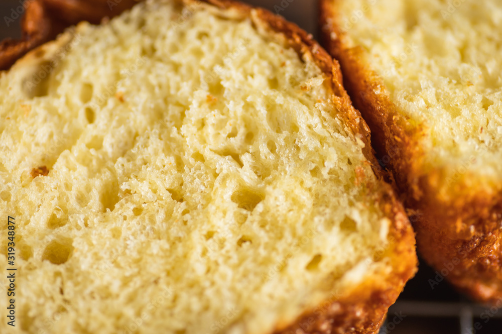 Close up texture of yellow brioche bread inside freshly baked from the oven. Close up texture of yellow brioche bread inside freshly baked from the oven.