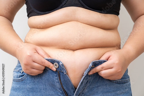 Overweight women wearing a jeans photo