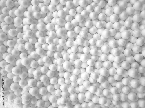 Background of white circle styrofoam ball pattern texture foam surface abstract background photo