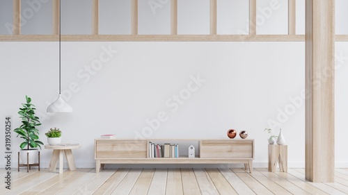 Cabinets and wall for tv in living room, white walls.