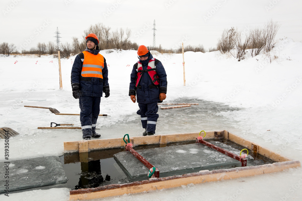 Two workers at the site of the ice camp Two workers at the site of the ice camp