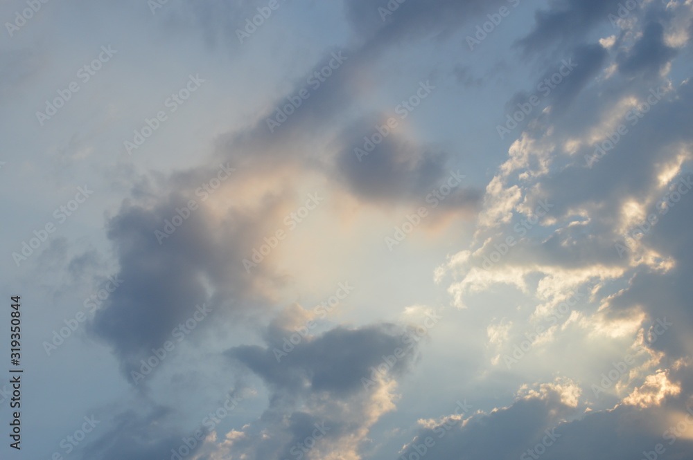 The light from the sun shining through the clouds