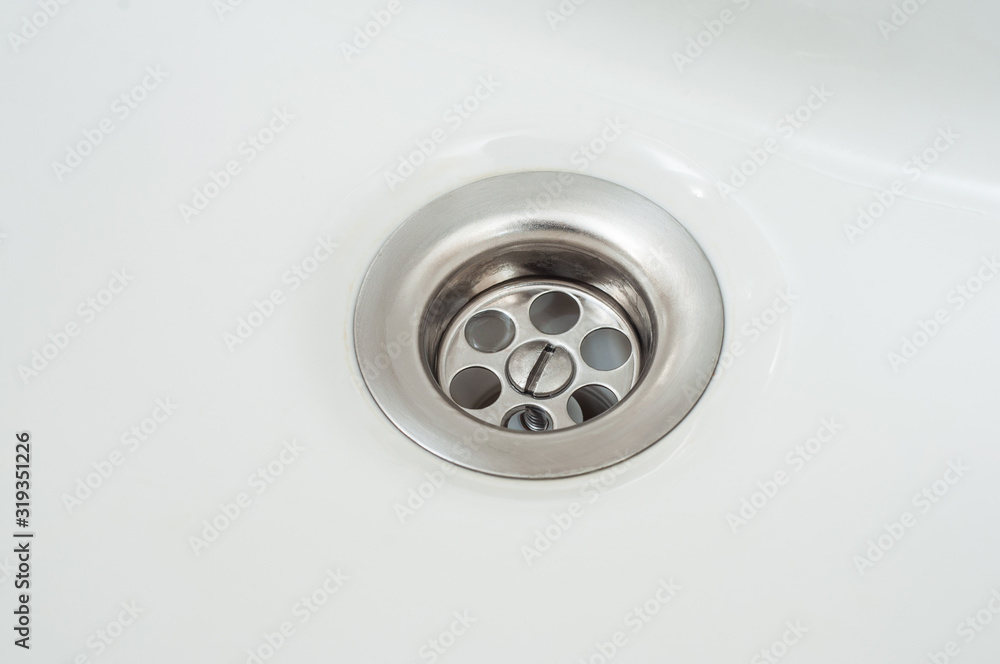 Clean shiny bath drain. Cleaning agent advertising. Clean shiny bath drain. Cleaning agent advertising.