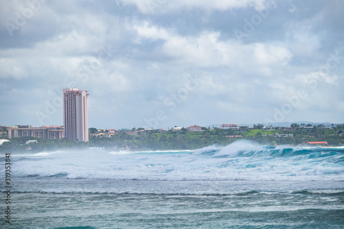 A windy day in Tumon Bay, Guam. Big waves in the sea.