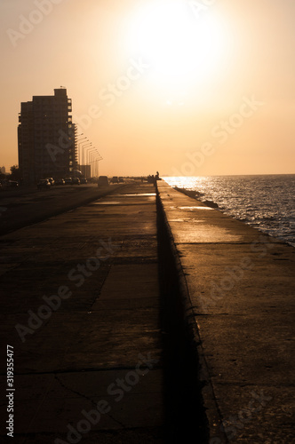 Malecon of Havana, Cuba. Sunset in the golden city. Travel locations: Caribbean, Cuba. 