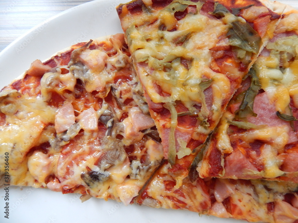 pieces of pizza on top of each other pieces of pizza on top of each other