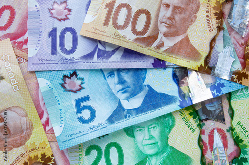 Photography A collage of Canadian currency bills