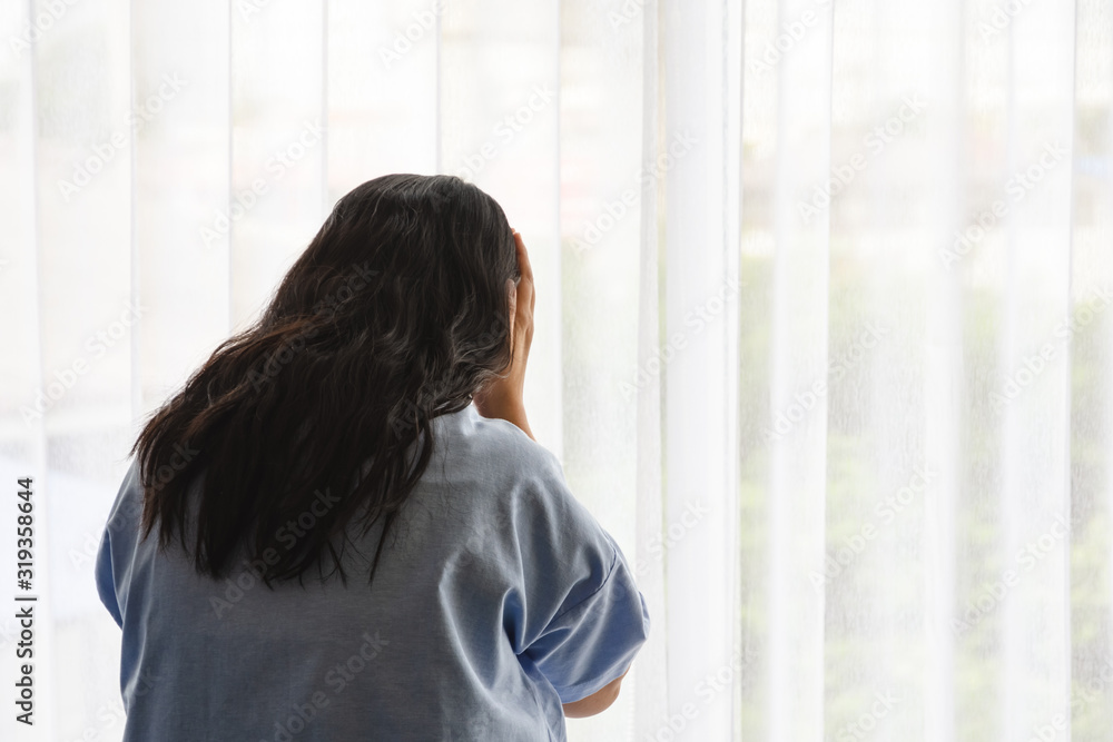 Asian female patient stress with illness in hospital room. Healthcare concept.. Asian female patient stress with illness in hospital room. Healthcare concept..